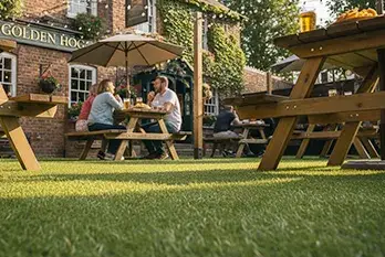 Durable artificial grass for commercial settings such as high traffic areas in pub beer gardens and restaurants
